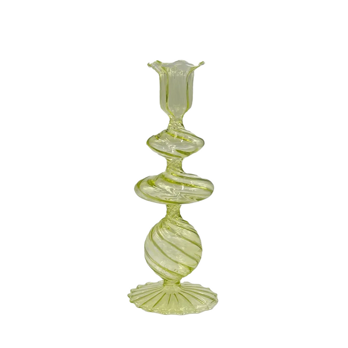 A green glass candlestick with a swirl design, featuring a cylindrical holder on top for a candle.