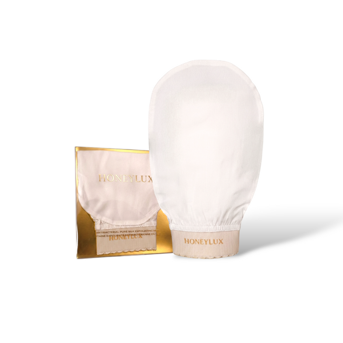 White glove with gold Honeylux packaging on a white background