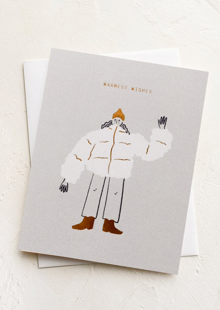 A greeting card with illustration of girl in a puffer coat waving, text reads "Warmest wishes".