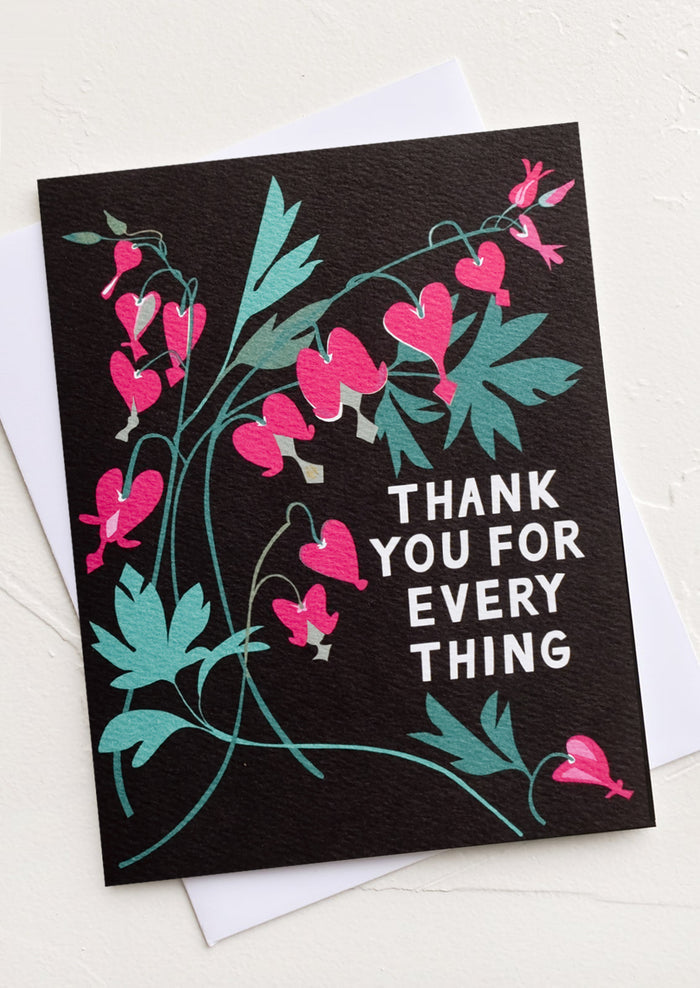 A black greeting card with illustration of bleeding heart plant and text reading "Thank you for everything".