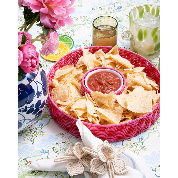 pink chip and dip server with salsa on a blue patterned tabelcloth