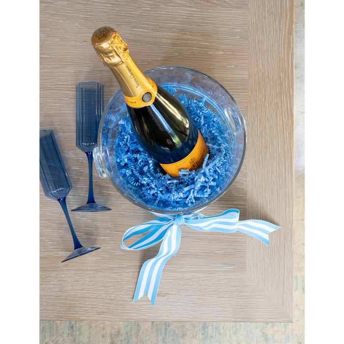 champagne in a bucket with glasses
