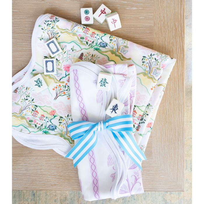 Game Table toppers with mahjong soaps wrapped in a blue and white ribbon