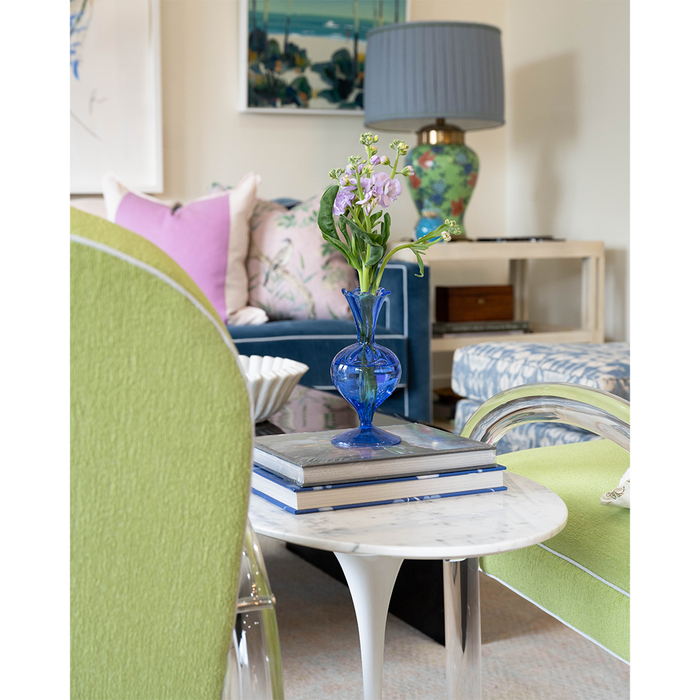 blue vase on top of books