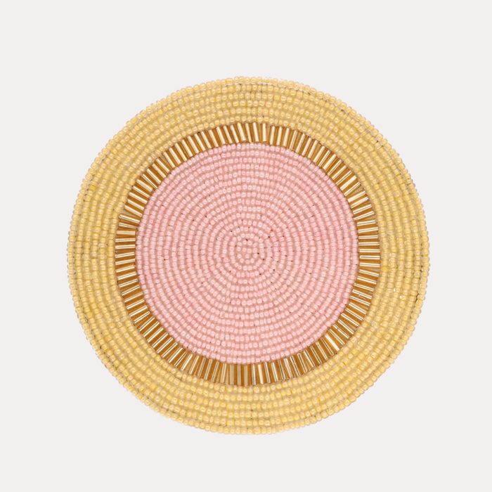 a close up of a beaded place mat