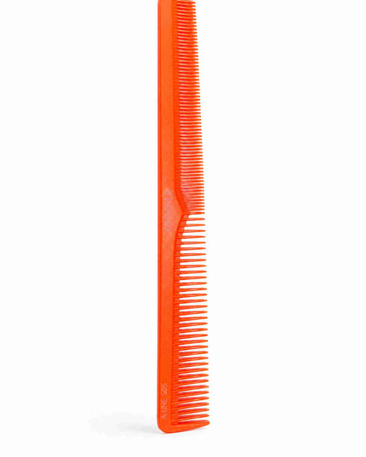 Orange salon styling comb with fine teeth and tapered handle