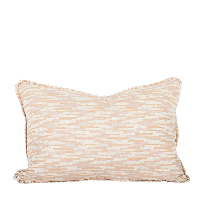 Lumbar pillow with geometric peach, pink, and beige design.