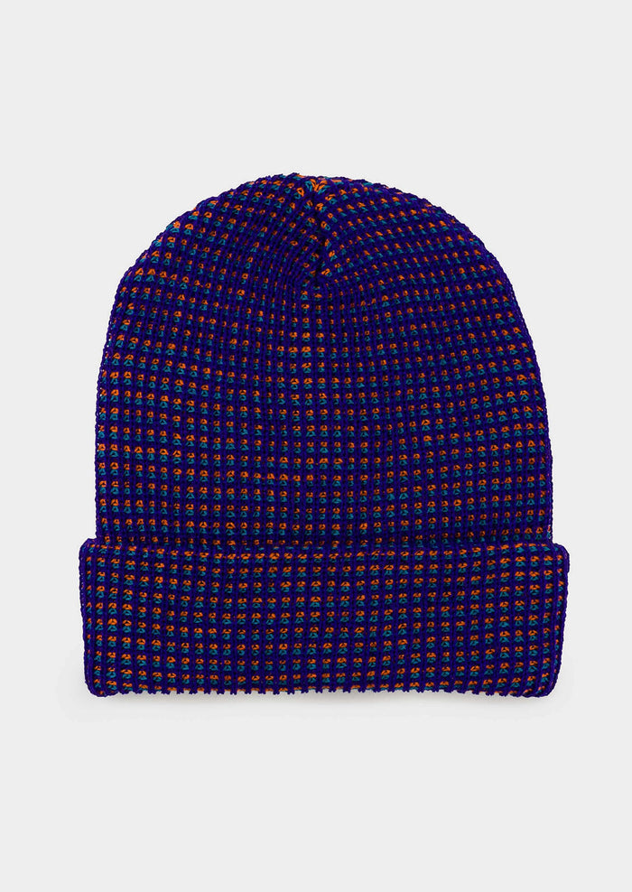 A rib knit beanie in indigo and red.