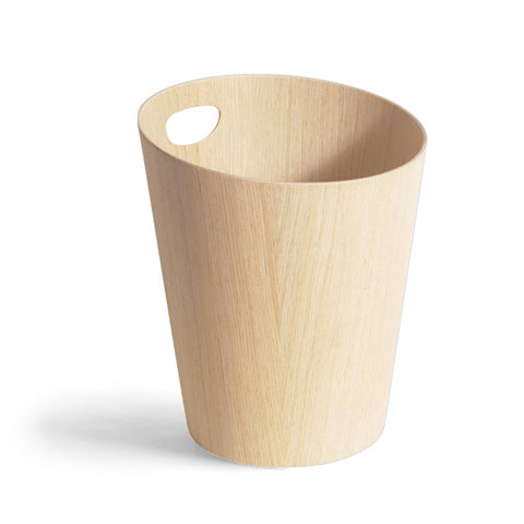 Silhouetted image of white oak paper waste basket with handle by Isamu Saito against white background.