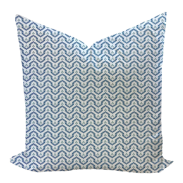 Decorative pillow with blue and white pattern on a white background